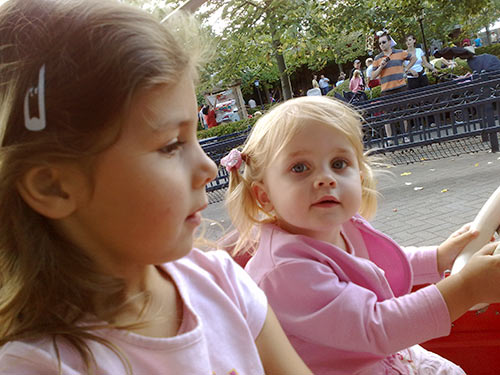 Berit and Livia in the Merry-go-round at Plopsaland